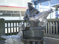 Fisherman and birds statue